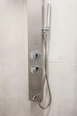 a shower with a hose in a shower stall at Modern 1BD AptWiFi,Gym,Washer in Philadelphia
