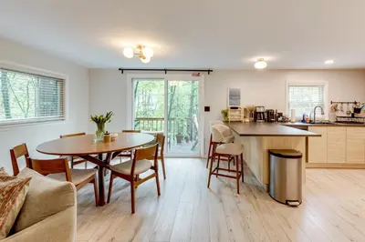 a kitchen and living room with a table and chairs at Lake Access at Family-Friendly Home in Tobyhanna in Tobyhanna