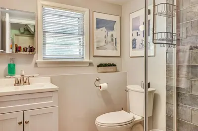 a bathroom with a toilet and a sink and a shower at 1 Mi to Campus Princeton Home with Furnished Deck in Princeton