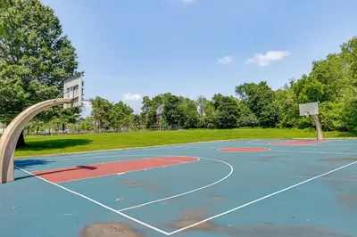an empty basketball court with a basketball hoop at 1 Mi to Campus Princeton Home with Furnished Deck in Princeton