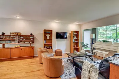a living room with a couch and a table and a piano at 1 Mi to Campus Princeton Home with Furnished Deck in Princeton