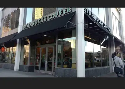 a store front of a building with a sign on it at Haven 2 Bedroom by EWR airport in Newark