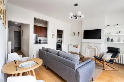 a living room with a couch and a table at Beautiful 3 Bedroom Unit in Prime Location in New York