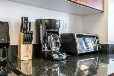 a kitchen counter with a coffee maker and a microwave at Bright 2 Bedrooms 2 Bathrooms Unit in New York