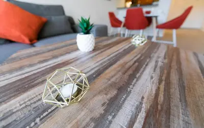a wooden table with a computer mouse on top of it at Beautiful 1 Bed Fully Furnished Apartment in New York
