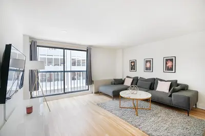 a living room with a couch and a table at Amazing Apartment for 2 1 Bed 1 Bath in New York