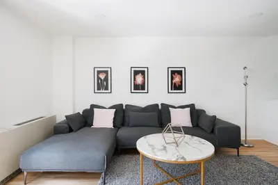 a living room with a couch and a table at Amazing Apartment for 2 1 Bed 1 Bath in New York