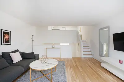 a living room with a couch and a table at Amazing Apartment for 2 1 Bed 1 Bath in New York