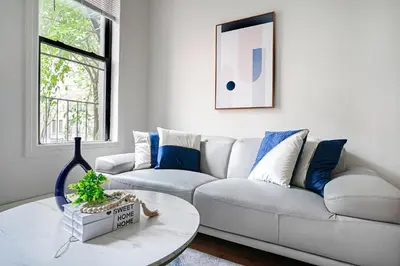 a living room with a couch and a table at Prime Upper west Side Location 1 Bedroom Apt in New York