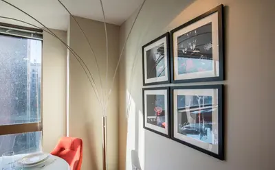 a room with three framed pictures on the wall at Fully Furnished Studio Apartment in New York
