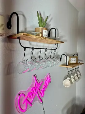 a shelf with wine glasses and a sign on a wall at BP STAYS - Hotel-Style, No Host, Professionally Managed ID252 in Jersey City