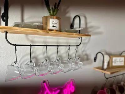 a group of wine glasses hanging on a shelf at BP STAYS - Hotel-Style, No Host, Professionally Managed ID252 in Jersey City