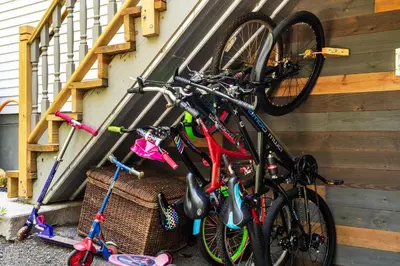 a group of bikes parked on the side of a house at Hideaway Hot Tub Sunna Lake Kayaks Pool in Bushkill
