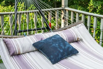 a blue pillow sitting on a hammock at Hideaway Hot Tub Sunna Lake Kayaks Pool in Bushkill