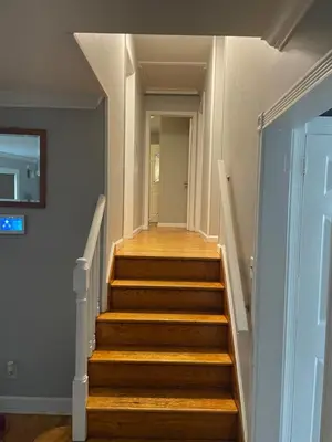 a staircase with wooden steps in a house at The Vault in Hillside