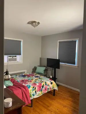 a bedroom with a bed and a television in it at The Vault in Hillside