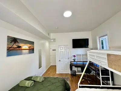 a bedroom with a bunk bed and a desk at BP STAYS - Hotel-Style, No Host, Professionally Managed ID255 in Jersey City