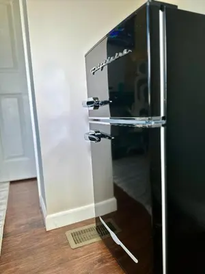 a refrigerator with a glass door in a room at Hotel-Style, No Host, Professionally Managed ID267 in Jersey City
