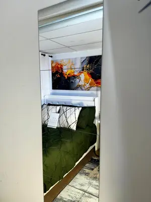 a bunk bed in a room with a green bed at BP STAYS - Hotel-Style, No Host, Professionally Managed ID280 in Jersey City