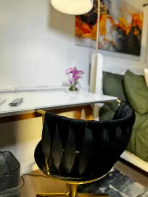 a black chair sitting in front of a desk at BP STAYS - Hotel-Style, No Host, Professionally Managed ID280 in Jersey City