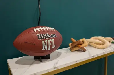 a football sitting on a table next to some snacks at Fly Eagles Fly StayPhilly Adventure in Philadelphia
