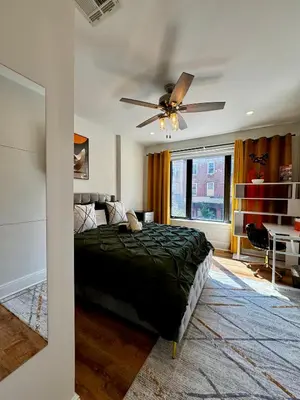 a bedroom with a bed and a ceiling fan at BP STAYS - Hotel-Style, No Host, Professionally Managed ID297 in Jersey City