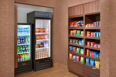 two refrigerators in a store with food and drinks at Fairfield Inn & Suites by Marriott Reading Wyomissing in Wyomissing