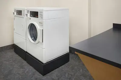 a washing machine in a room with a counter at Fairfield Inn & Suites by Marriott Reading Wyomissing in Wyomissing