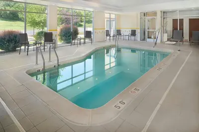 a pool in the middle of a building at Fairfield Inn & Suites by Marriott Reading Wyomissing in Wyomissing