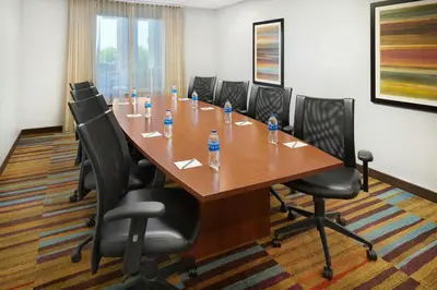 a conference room with a long table and chairs at Fairfield Inn & Suites by Marriott Reading Wyomissing in Wyomissing