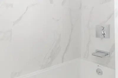 a white bathroom with a tub and a sink at Blueground Chinatown washer nr City Hall NYC-1871 in New York