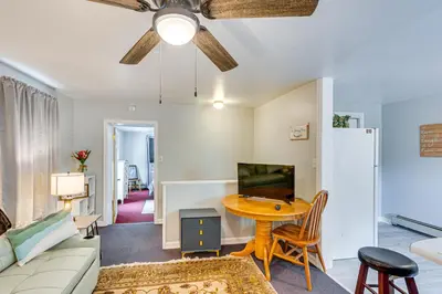 a living room with a table and a couch at Honey Bee Farm On-Site Susquehanna Valley Apt! in Dalmatia