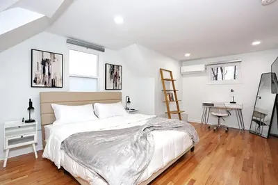 a bedroom with a bed and a desk at NEW Modern NYC Escape near MetLife AmDream MALL EWR in Bergenfield