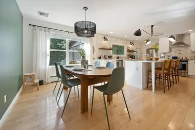 a kitchen and dining room with a table and chairs at Stylish Catskills Escape Near Town & Trails in Livingston Manor
