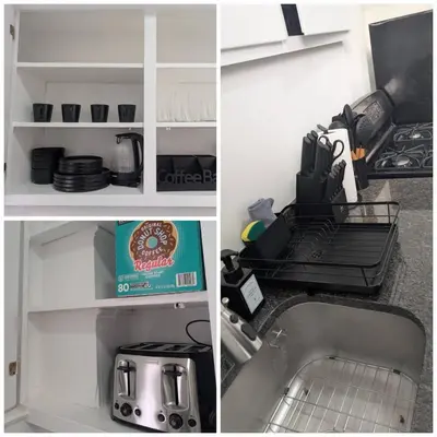 a kitchen with a sink and a counter top with a shelf at Central brownstone in Hoboken Dwntn! 15 mins to NY in Hoboken