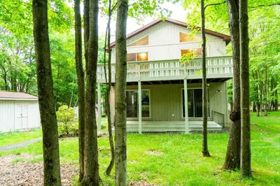 a house in the woods with trees at Deer Crest Cabin 5Bedroom near JFBB ski area/Lake in Albrightsville