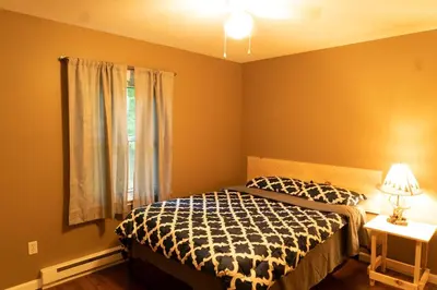 a bedroom with a bed and a window at Deer Crest Cabin 5Bedroom near JFBB ski area/Lake in Albrightsville