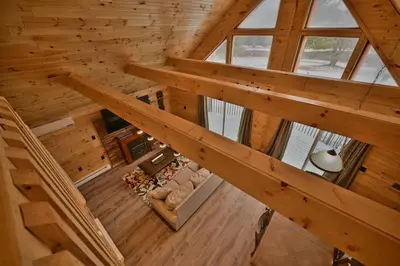 an overhead view of a cabin with wooden ceilings at NEW ! Lake front Lookout Log Cabin! Private Lake ! in White Haven