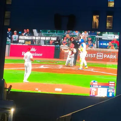 a tv screen showing a baseball game on a field at 42th Powelton in Philadelphia
