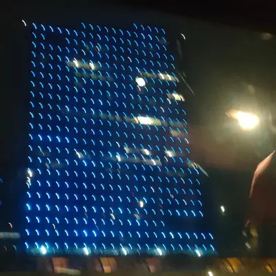 a building with blue lights on it at night at 42th Powelton in Philadelphia
