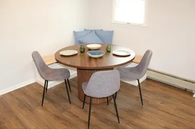 a dining room table and chairs in a room at Lakefront Haven on Greenwood Lake in West Milford