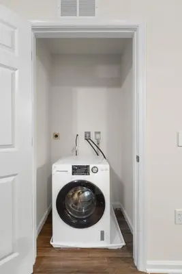 a washer and dryer in a laundry room at Traveler Haven XL NYC & NWK with free parking in Newark