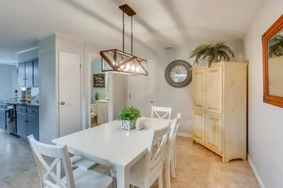 a kitchen and dining room with a white table and chairs at Family Retreat Near Hersheypark with Horse Farm View in Elizabethtown