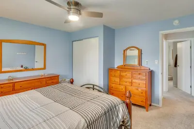 a bedroom with a bed and a dresser and a mirror at Family Retreat Near Hersheypark with Horse Farm View in Elizabethtown