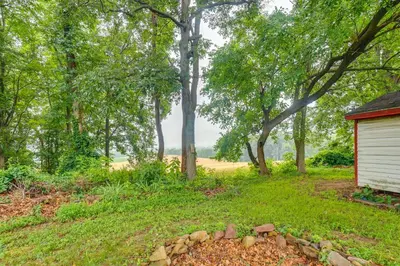 a yard with a building and a pile of rocks at Family Retreat Near Hersheypark with Horse Farm View in Elizabethtown