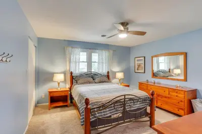 a bedroom with a bed and a dresser and a mirror at Family Retreat Near Hersheypark with Horse Farm View in Elizabethtown