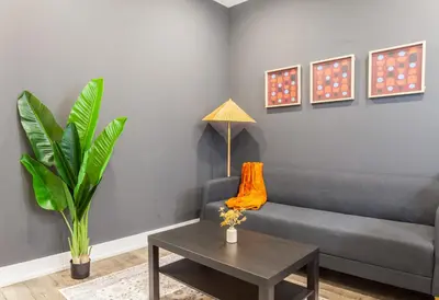 a living room with a couch and a table at 4BR 3Bath Home WDParkingYard Sleeps 10 in Philadelphia