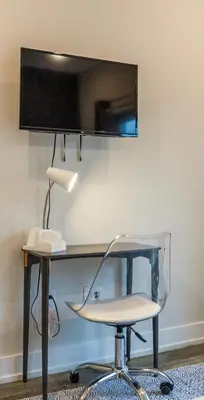 a desk with a chair and a desk with a lamp at 4BR 3Bath Home WDParkingYard Sleeps 10 in Philadelphia