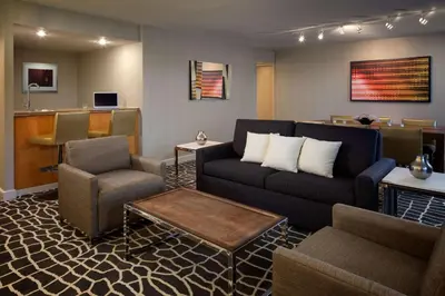 a living room with a couch and a chair at Hyatt Regency Princeton in Princeton