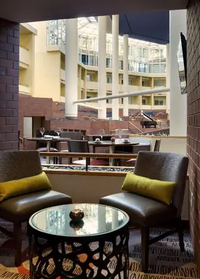 a lobby with two chairs and a glass table at Hyatt Regency Princeton in Princeton
